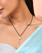 Jewels Nest Classic Gold-Tone White Stone Mangalsutra With Single Drop Tassel Pendant | Grab2Buy