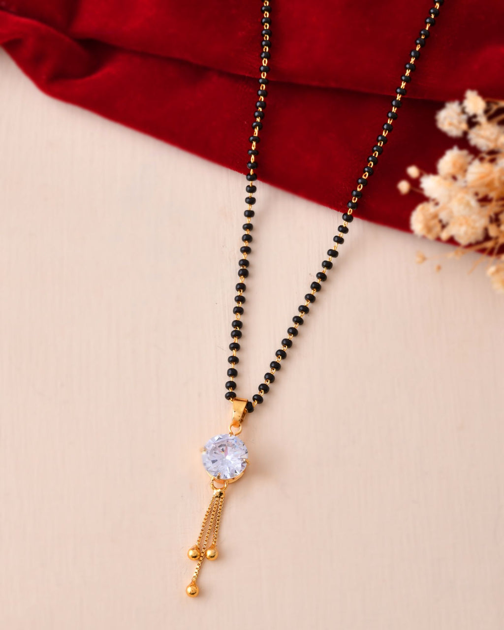 Jewels Nest Classic Gold-Tone White Stone Mangalsutra With Single Drop Tassel Pendant | Grab2Buy