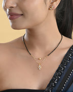 VOJ Gold-Polished Doll Shapped Stone Studded Mangalsutra With Earrings Set
