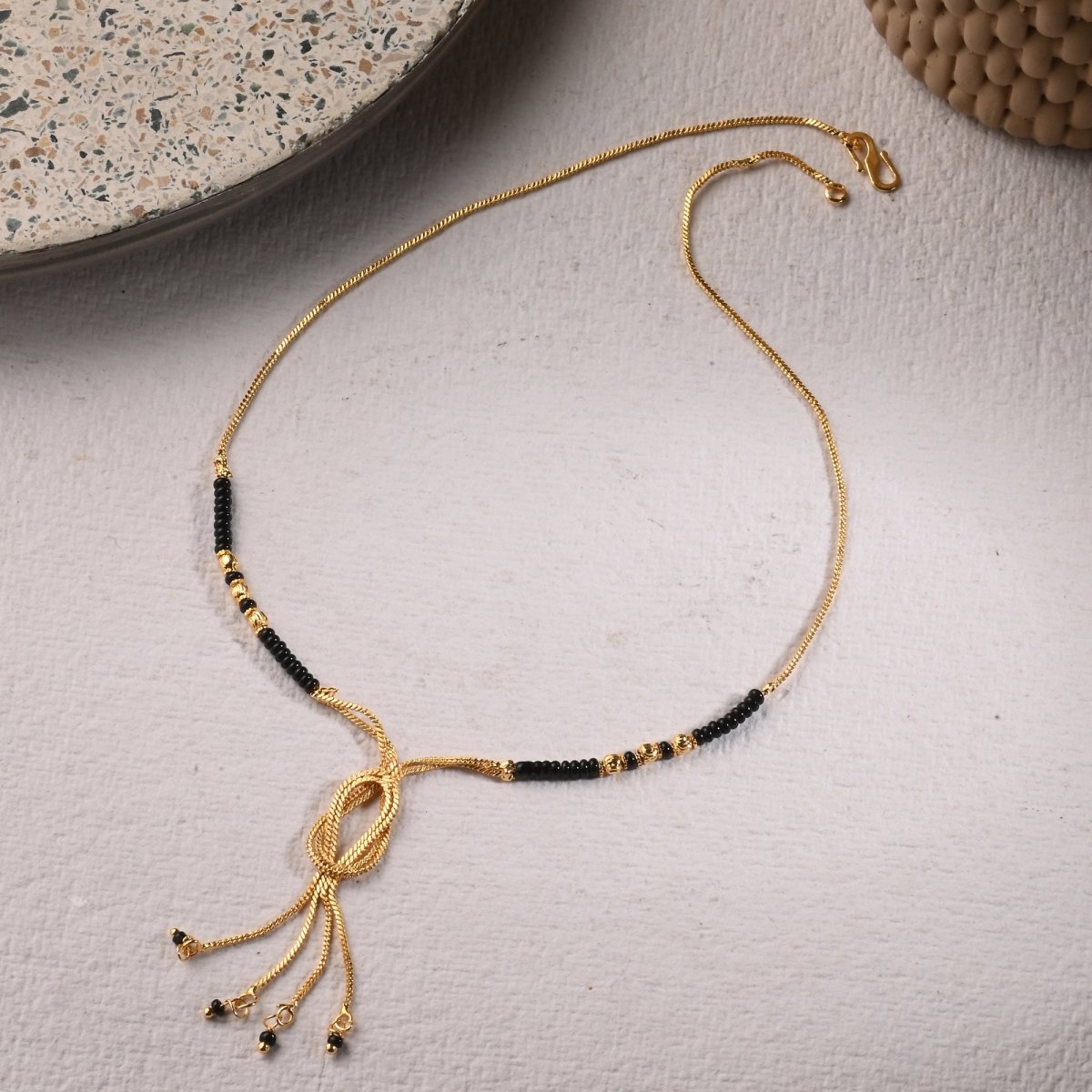AanyaCentric Gold-Polished Jewelry Combo: Elegant Short Mangalsutra, Finger Ring, and American Diamond Earrings Set | Grab2Buy