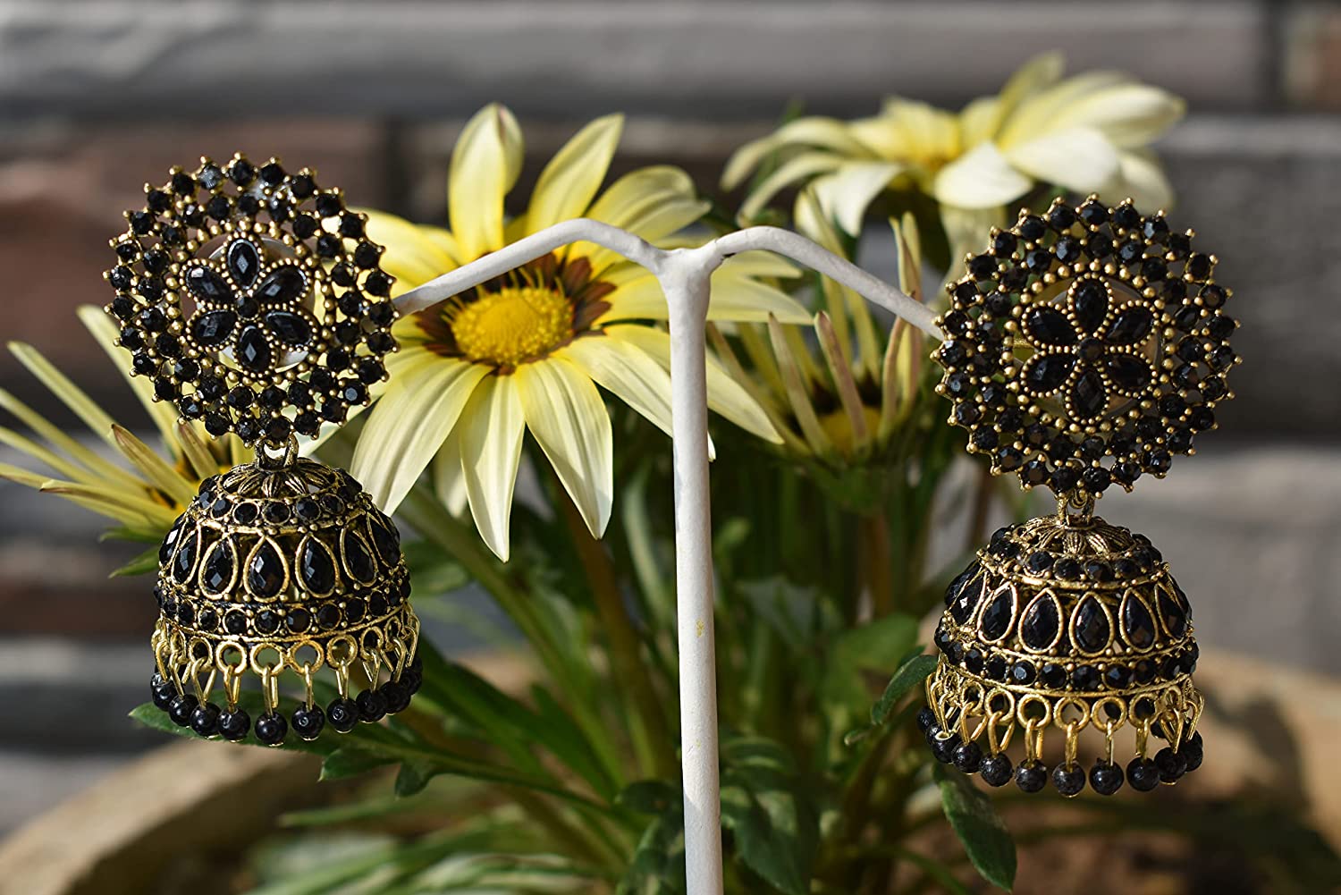 Gold-Polished Alloy Black Rhinestones Studded Jhumki Earrings - The Pari | Grab2Buy